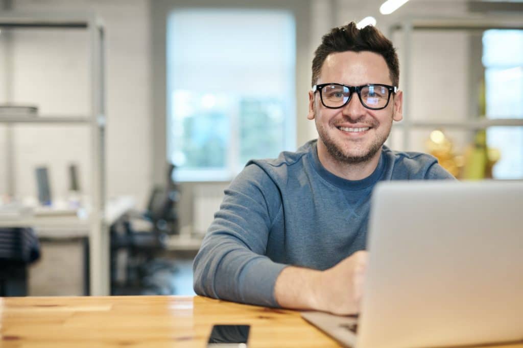 Man at laptop for ibm i security
